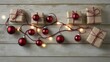 © Arti - Festive holiday decorations featuring wrapped gifts, red ornaments, and fairy lights on a rustic wooden background