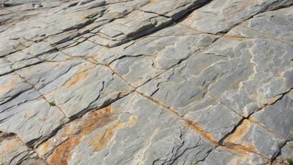 Aufkleber - A close-up of rugged rock formations with intricate cracks and patterns, showcasing the beauty of natural weathering.