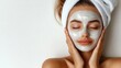 © Suzi - A woman with a facial mask enjoying a skincare routine, promoting relaxation and self-care.