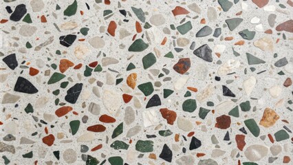 Aufkleber - A close-up of a terrazzo surface with a mix of white, black, green, and red stones