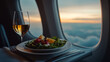 © Tahsin - Dining at sunset while flying above the clouds with a refreshing salad and wine.