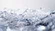 © Tahsin - Water droplets creating splashes and ripples in clear liquid.