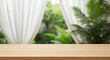 © Dostain - Wooden surface with blurred window, evoking a sense of relaxation and connection to nature
