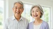 © Yuudaishin - Happy Elderly Japanese Couple Smiling in a Bright and Peaceful Home Setting