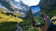 © PiscesserA - Hiking Navigation App on Smartphone in Alpine Scenery
