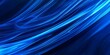 © Rasim - Abstract background featuring dynamic blue lines, creating an intriguing visual effect. This blue lines background is perfect for various creative projects and design applications.