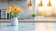 © Sirada - A blurred kitchen interior featuring sleek modern appliances, a marble countertop, and overhead pendant lighting creating a soft, inviting ambiance.