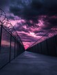 © MinimalZine - Dramatic Sunset Over Barbed Wire Fence Leading to Distant Horizons