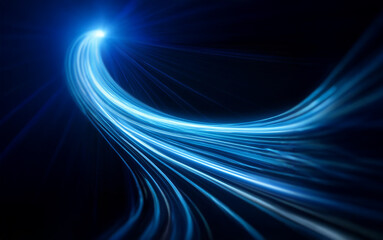 Leinwandbilder - A glowing blue streak of light curves across a dark background. The light trails create a sense of speed and energy.