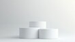 © chesleatsz - Three White Cylindrical Display Stands on White Background