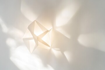 Poster - Geometric paper sculpture on white surface with soft shadows.