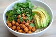 © Babycrab - Healthy vegan bowl with chickpeas, broccoli, avocado, quinoa and cilantro.
