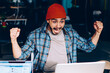 © BullRun - Overjoyed male football fan amazed with victory of team watching match screaming and cheer up during working process, emotional hipster guy raising hands  celebrating great news of winning in contest