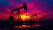 © Theeranan - Silhouette of Oil Pumps Against a Dramatic Sunset with Vibrant Colors and Reflective Puddles on a Oil Field Landscape