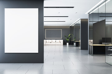 Modern corporate office interior with blank vertical white canvas on dark wall, glass partitions, and elegant furniture. 3D Rendering