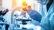 © 路加 石 - Researcher in a lab coat conducting safety testing procedures on a small device, wearing protective goggles and gloves, with a blurred background of lab equipment.