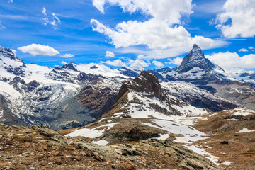 Canvas Print - Scenic view on snowy Matterhorn mountain peak in sunny day with blue sky in Switzerland. Beautiful nature background of Swiss Alps covered with snow. Famous travel destination