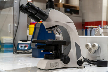 Wall Mural - microscope on the scientific laboratory of a hospital, symbol of medical and pharmaceytical technolo
