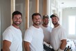 © Milos - A group of skilled workers is smiling and posing together on-site, representing teamwork and collaboration in a construction or renovation project.