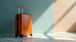 © chaiyadid - Sunlit brown suitcase awaits journey; marble floor, pastel background.  Ready for adventure?