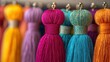 © Iurii - Colorful textile tassels hanging in a vibrant display at a craft market