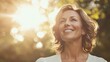 © ANIR EL KHADAJI - A middle-aged woman with shoulder-length brown hair smiles joyfully outdoors, bathed in the warm golden light of the setting sun.