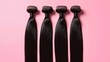 © Vadym - Four long silky black hair bundles lie flat against pink background. Hair bundles smooth, straight. Hair extensions ready to use for beauty salon hair salon. Well presented for sale in salon. Pro