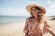 © Igor - Portrait of beautiful young woman wearing summer dress and hat on the beach
