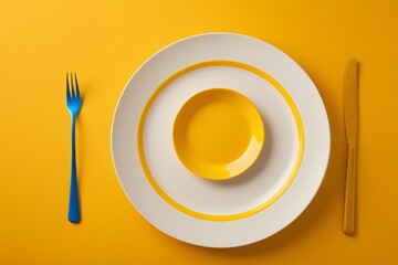 a white plate with a fork and knife