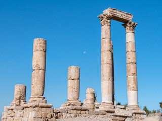 Ancient pillars standing at the Amman Citadel, Jordan on a sunny morning - Landscape shot