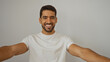 © Krakenimages.com - Young hispanic man smiling confidently against white background, expressing happiness and self-assurance in a clean and neutral setting while showcasing his natural charm.