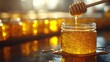 © aritha - A close-up of honey dripping from a wooden dipper into a jar, showcasing its golden texture.