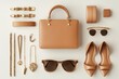 © Isuru - A flatlay showcasing a tan leather handbag, gold jewelry, sunglasses, and shoes.