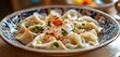 © Jardel Bassi - A close-up of delicious Turkish Manti dumplings topped with yogurt, garlic sauce, and paprika butter, presenting a mouthwatering culinary delight.