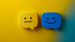 © Atmospheric stock - Contrasting emotions: yellow neutral and blue smiley faces on vibrant background