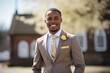 © Inigo - Portrait of a smiling african american groom standing outside in park