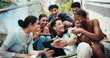 © peopleimages.com - Students, laughing and tech on stairs at campus, wow and share meme with diversity from low angle at university. Group, friends and happy on steps with phone, tablet or comic video on app at college