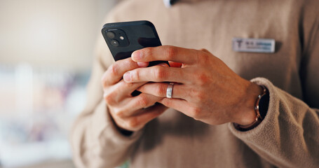 Fototapete - Break, hands and businessman in office with smartphone for texting on social media, network and website. Badge, name tag and consultant with mobile in workplace for message, technology closeup or app