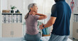 © peopleimages.com - Neck pain, physiotherapy and advice with old woman in clinic for healthcare, osteoarthritis or symptoms. Medical, physical therapy and helping with patient for chiropractor and rehabilitation