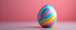 © SemangArt - A colorful, swirled Easter egg against a soft pink background.