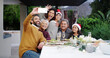 © peopleimages.com - Christmas, happy or family with selfie at dinner by home for holiday memory, profile picture update or bonding. People, parents or grandparents with kids on patio for celebration, care or photography