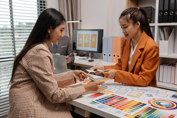 Wall Mural - ux developer and ui designer brainstorming about mobile app interface wireframe design in the office