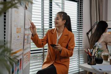 drawing website ux ui app for mobile phone application and development template layout, UI development, designer team working on a project of ux ui in creative office, team of creative web