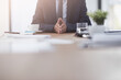 © peopleimages.com - Business man, hands and waiting in meeting for lawyer brief, interview and legal work in boardroom. Mockup, professional suit and law consultant with attorney, authority and decision at table