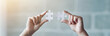© peopleimages.com - Hands, banner and person with puzzle by office brick wall for building, development or connection. Planning ideas, innovation and strategy with creative employee holding jigsaw pieces closeup at work