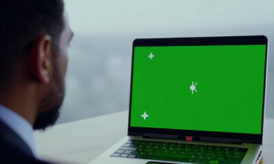 Businessman Working on Laptop with Green Screen