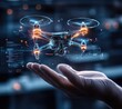© Narongsak - A holographic drone hovers above a hand, symbolizing the cutting-edge technology of the future.