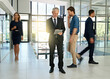 © peopleimages.com - Business people, walking and man on tablet in office for productivity, synergy and coworking. Professional, corporate workers and mature person in busy workplace for movement, rush and hurry in lobby