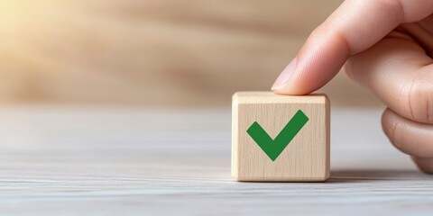 Hand placing a wooden block with a green check mark symbol on white background