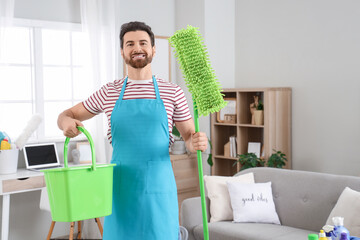 Wall Mural - Male janitor with mop and bucket in room